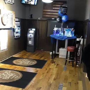 Example of sports room with two billiards tables and several dart boards.