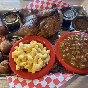 Half a smoked chicken with beans, macaroni and cheese and hush puppies and my shock hush puppies were great