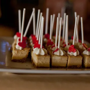 The attention to detail makes everything so special. Individual red hearts on the caramel cheesecake pops.