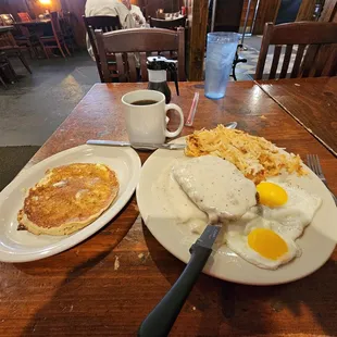 Country fried steak, eggs sunnyside up, and pancake