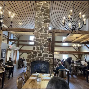 a stone fireplace in a restaurant