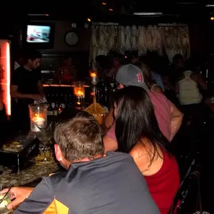 people sitting at the bar