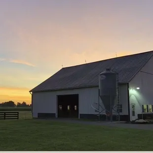 a barn at sunset