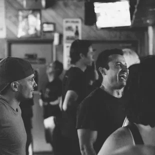 a group of people in a bar