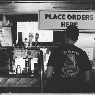 a man standing at a bar