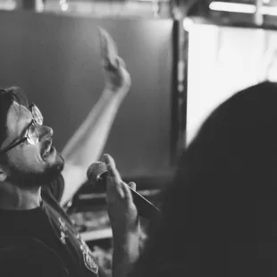 a man singing into a microphone