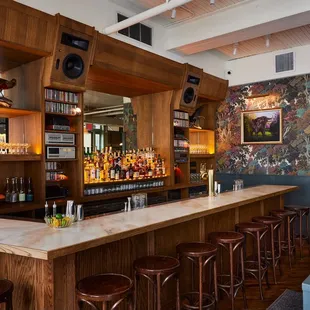a bar with wooden bar stools