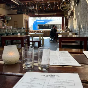 a menu and glasses on a table