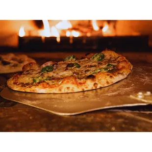 a pizza on a baking sheet
