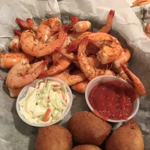 a plate of shrimp and potato balls