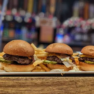 three burgers and fries