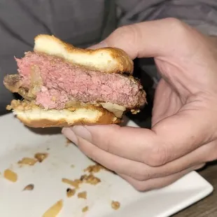 a man holding a sandwich
