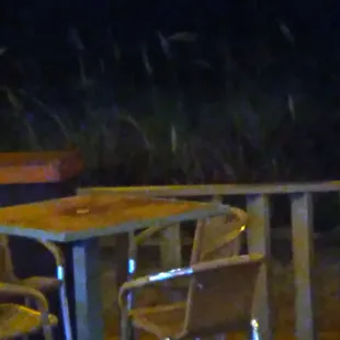 Outdoor tables and view (well the ocean is part those sea oats)
