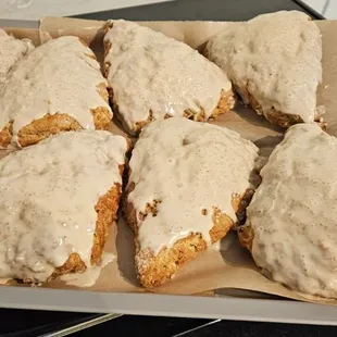 a tray of glazed scones