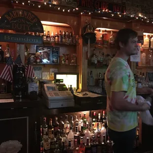 a man standing at the bar
