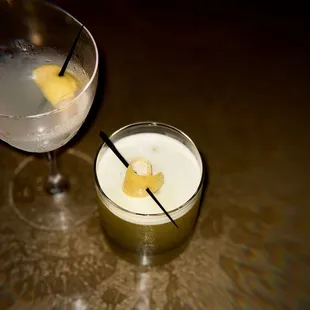 two cocktails on a table