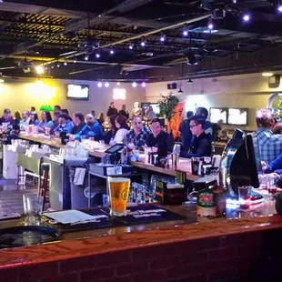 a crowd of people at a bar