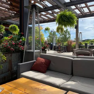 a patio with a couch and table