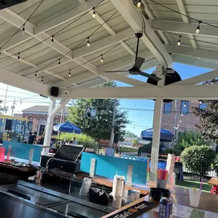 an outdoor patio with a grill