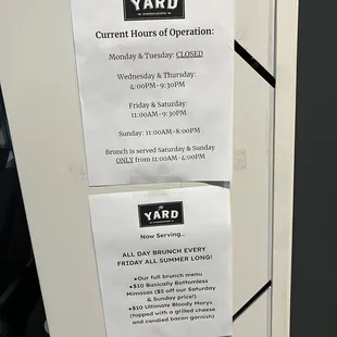 a sign posted on a refrigerator