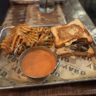 Gourmet grilled cheese with two beef patties. Sorry I don&apos;t remember the name.