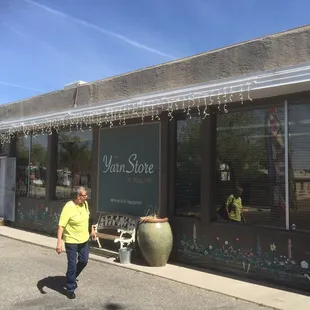 Exterior of store. Parking lot is small.