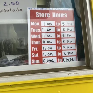 a store hours sign