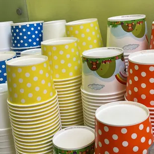a stack of colorful cups