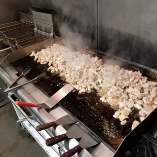 Cooking up some chicken for chicken alfredo for a catering customer.