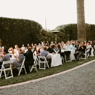Great grass on either side of a gravel driveway.