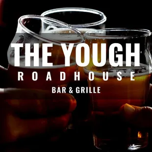 two people holding glasses of beer