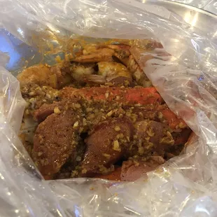 Crab and shrimp combo with smoked sausage Yummy special sauce; Cajun &amp; garlic butter