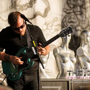 a man playing an electric guitar