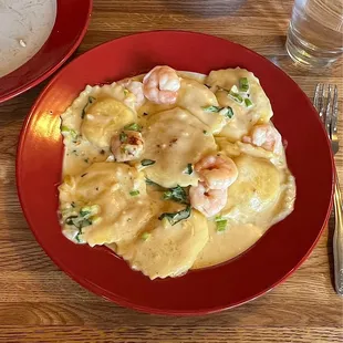 Raviolis with lobster filling and shrimp.