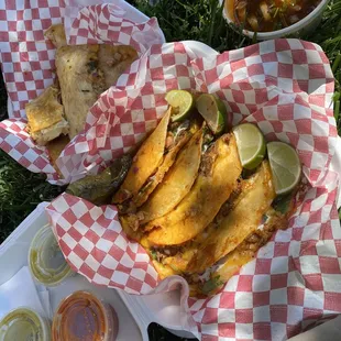 Birria tacos w/ a side of consome and a chicken quesadilla.
