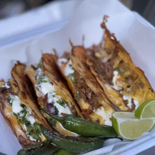 Birria tacos with grilled pepper.