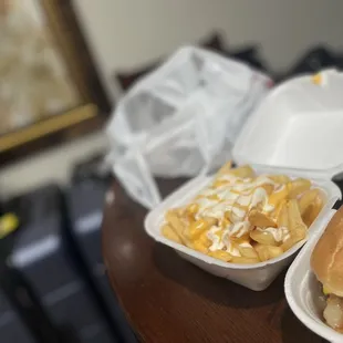 two takeout containers of food