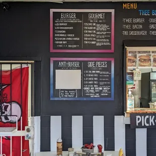 Menu board.  The healthy hamburgers are all blocked out.