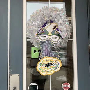 Cute Mardi Gras decor on the door!