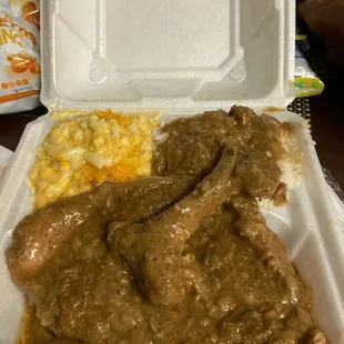 Smothered pork chops with rice and gravy &amp; macaroni and cheese