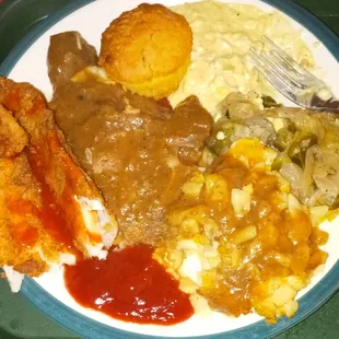 Pork chops, mac, cabbage, cornbread, and fish.