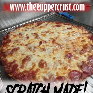 a pizza with cheese and pepperoni