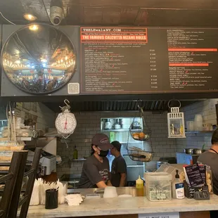 two people working at a restaurant counter