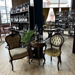 two chairs and a table in a wine shop