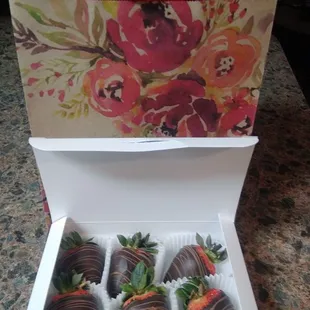 a box of chocolate covered strawberries