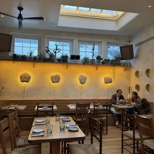 two people sitting at a table in a restaurant
