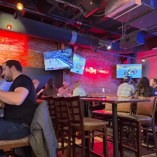 a group of people sitting at a bar