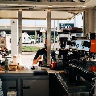 a man working in a coffee shop