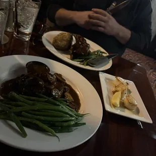 Garlic stuffed fillet, green beans, and scallops. Other plate Australian Lamb chops