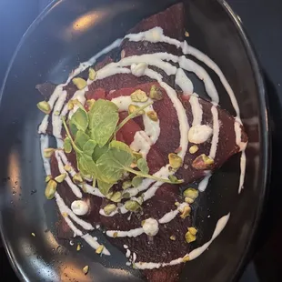 Watermelon carpaccio. What an unusual and refreshing dish! I&apos;ve never had such a combo and when you get everything in one bite, amazing!